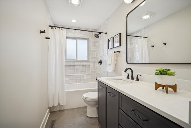 full bathroom featuring tile patterned floors, vanity, toilet, and shower / bath combo