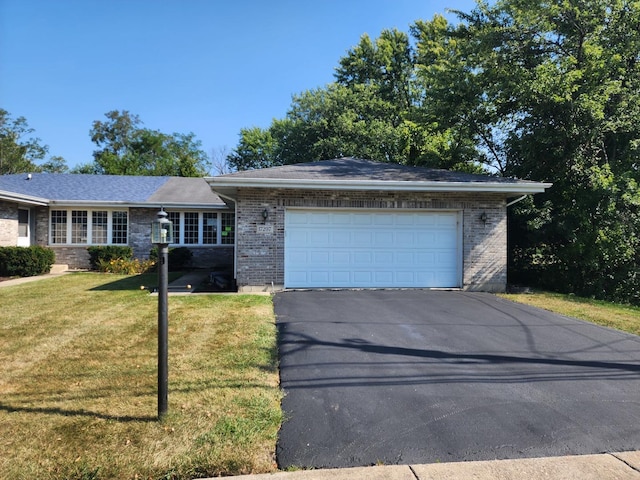 single story home with a garage and a front yard