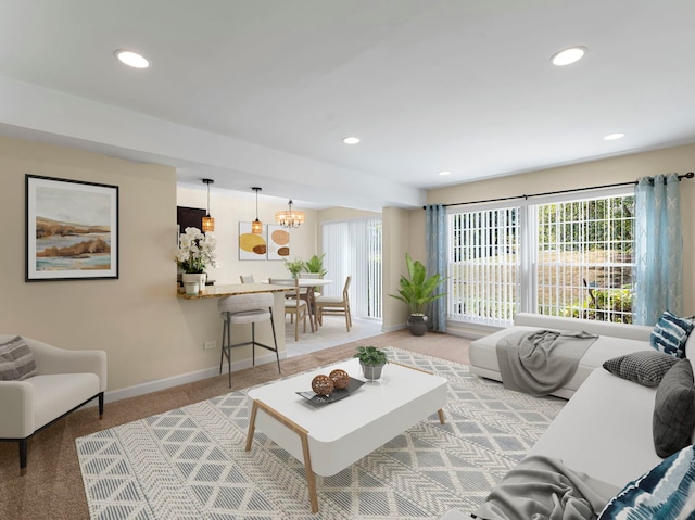 living room featuring light carpet and a notable chandelier