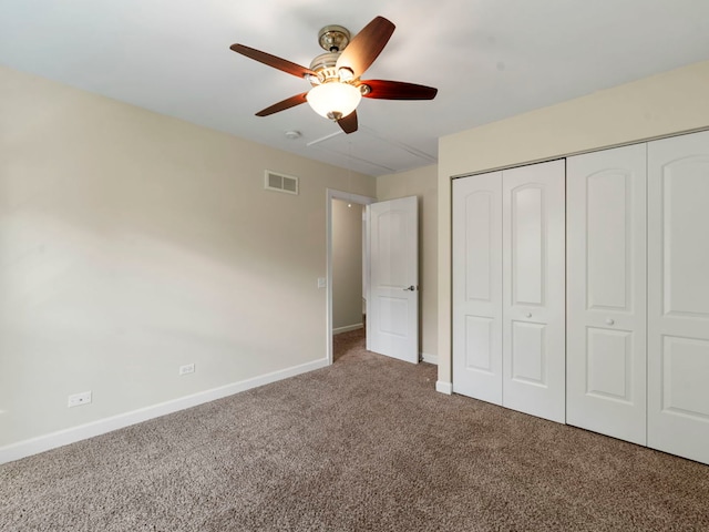 unfurnished bedroom featuring ceiling fan, carpet floors, and a closet