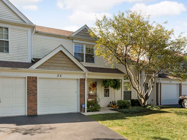 view of front facade featuring a garage and a front lawn