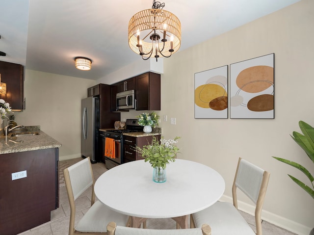 tiled dining area with an inviting chandelier and sink