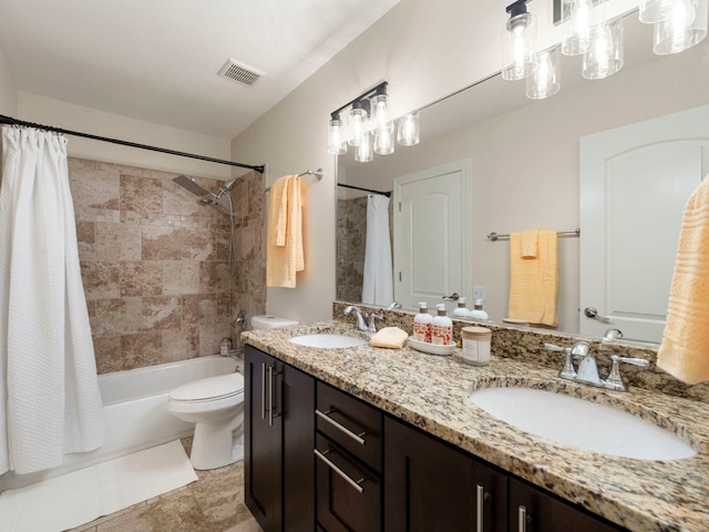 full bathroom with vanity, toilet, and shower / tub combo