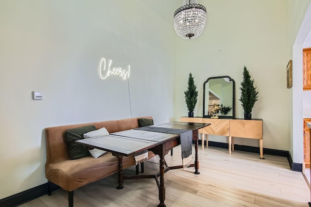 dining room featuring an inviting chandelier and light wood-type flooring