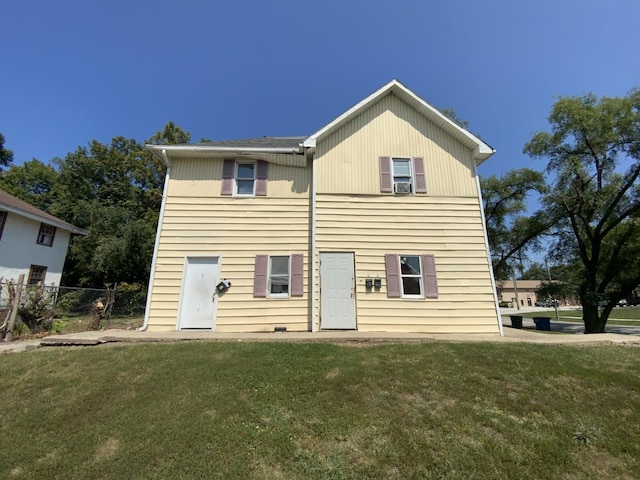 back of house with a yard