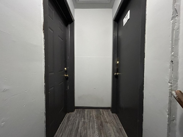 hallway featuring dark wood-type flooring