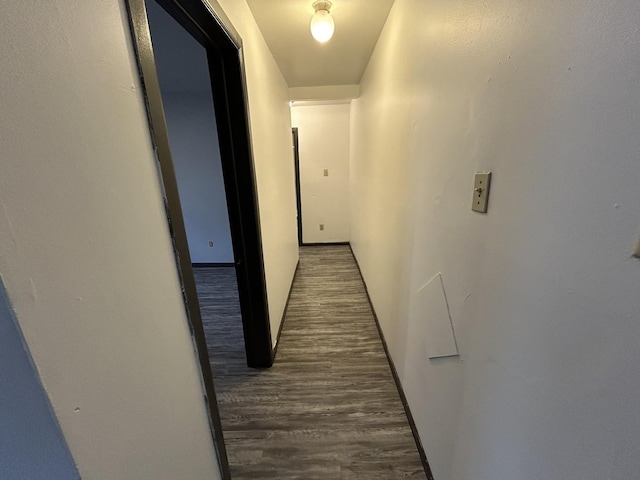 corridor with dark wood-type flooring