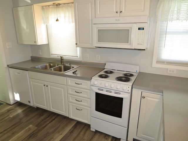 kitchen with sink, dark wood-type flooring, white cabinets, and white appliances