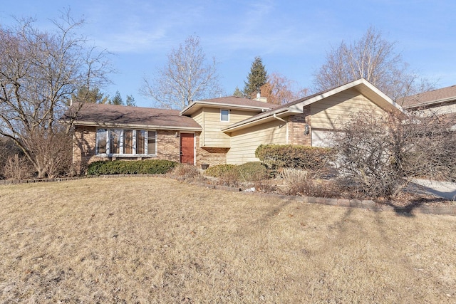 split level home with a front yard