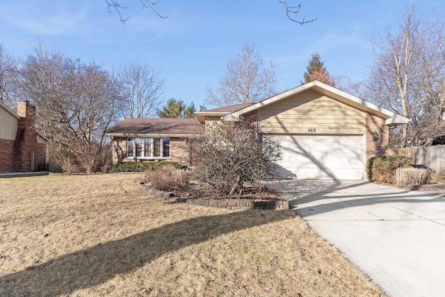 single story home featuring a garage and a front yard