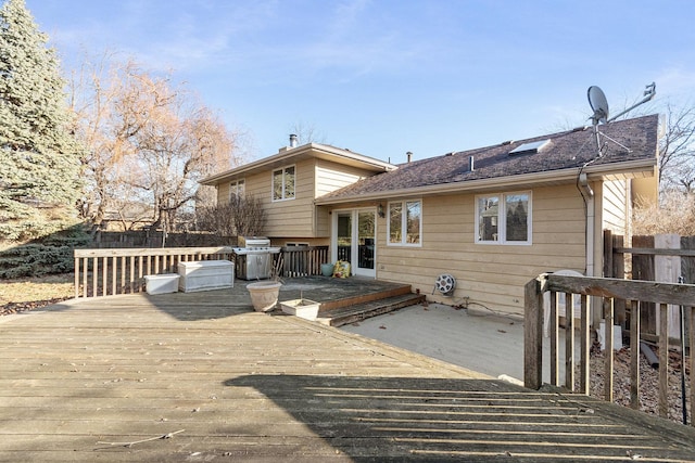 rear view of house with a wooden deck