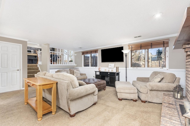 living room featuring crown molding and carpet floors