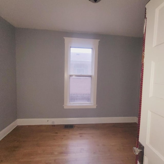 empty room featuring hardwood / wood-style floors