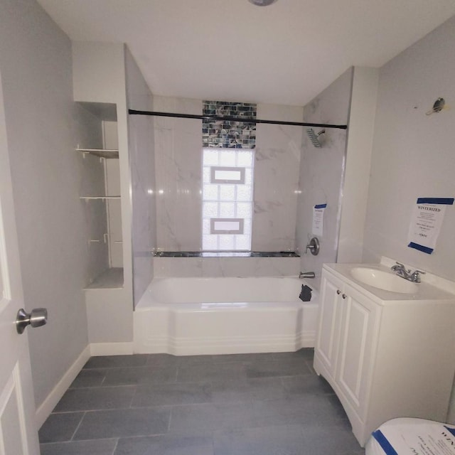 bathroom with tiled shower / bath and vanity