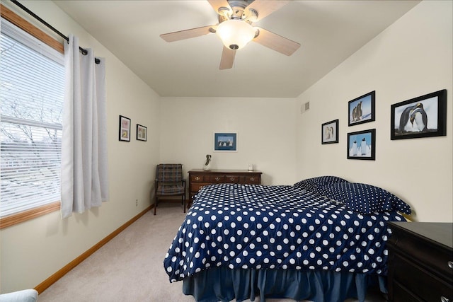 bedroom featuring light carpet and ceiling fan