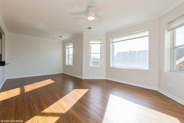 spare room featuring crown molding, ceiling fan, and dark hardwood / wood-style flooring