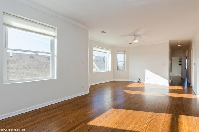 empty room featuring ceiling fan, ornamental molding, and dark hardwood / wood-style flooring