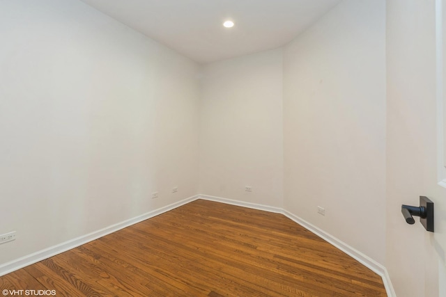 unfurnished room featuring hardwood / wood-style flooring