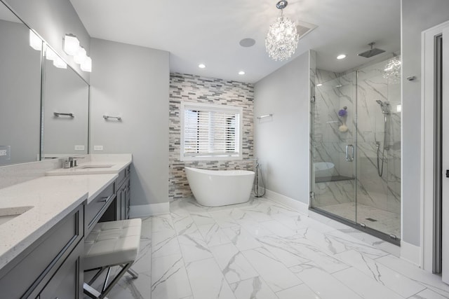 bathroom with vanity and independent shower and bath