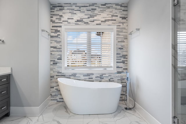 bathroom with vanity and a tub to relax in