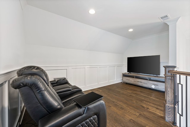 living room featuring vaulted ceiling and dark hardwood / wood-style flooring