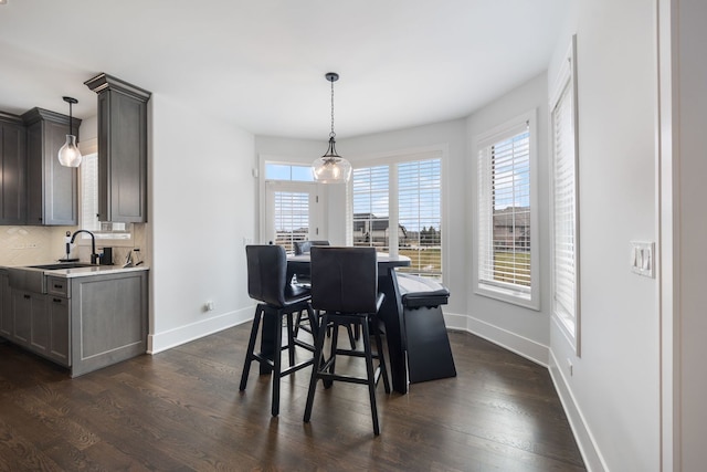 dining room featuring dark hardwood / wood-style floors and sink