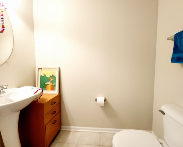 bathroom featuring tile patterned floors and toilet