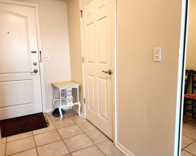 doorway to outside featuring light tile patterned floors