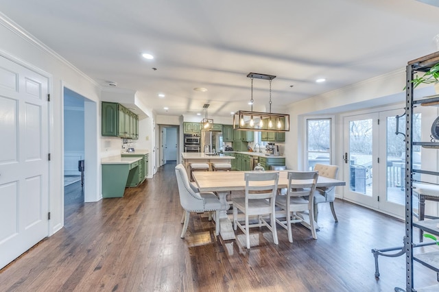 dining area featuring crown molding and dark hardwood / wood-style floors