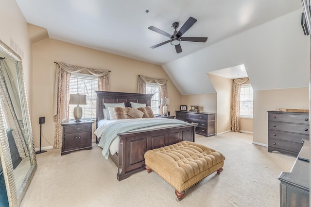 carpeted bedroom featuring lofted ceiling and ceiling fan