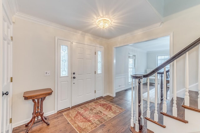 entryway featuring crown molding and hardwood / wood-style floors