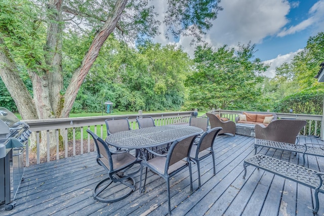 deck featuring a grill and an outdoor hangout area