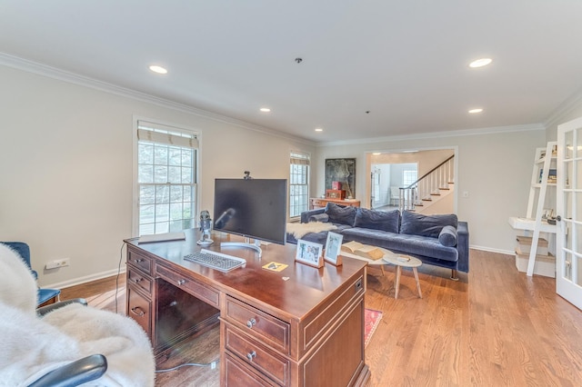 office space featuring french doors, ornamental molding, and light hardwood / wood-style flooring