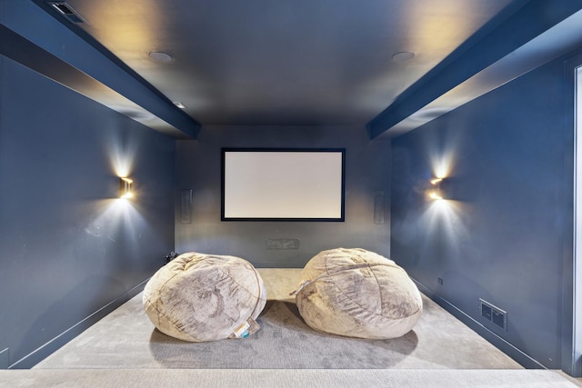 home theater with carpet flooring, visible vents, and baseboards