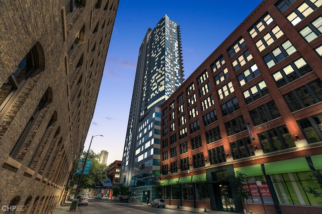 view of outdoor building at dusk