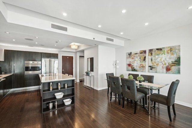 dining room with dark hardwood / wood-style flooring