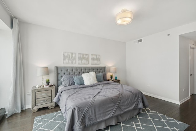 bedroom featuring dark wood-type flooring