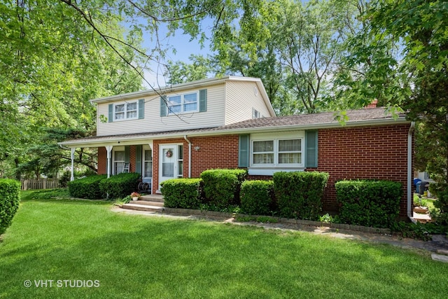 view of front property featuring a porch and a front yard