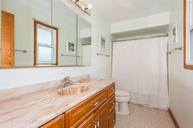 bathroom featuring tile patterned flooring, vanity, a shower with shower curtain, and toilet