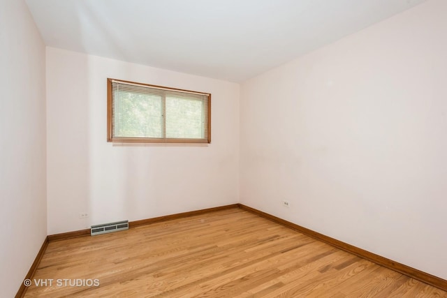 unfurnished room with light hardwood / wood-style flooring