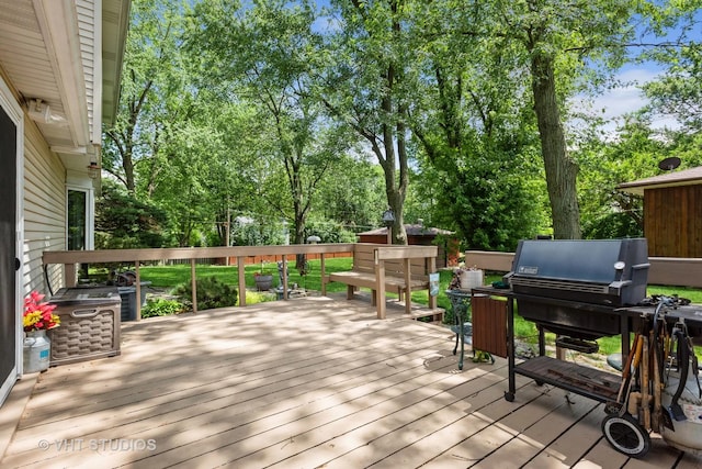 wooden deck featuring grilling area