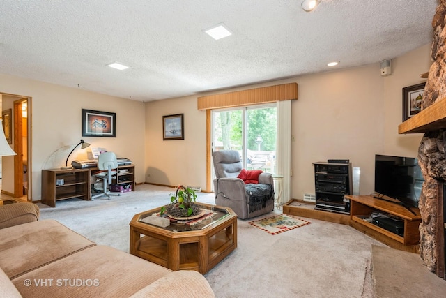 carpeted living room with a textured ceiling