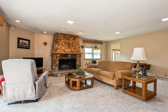 living room with light colored carpet, a stone fireplace, a textured ceiling, and a baseboard heating unit