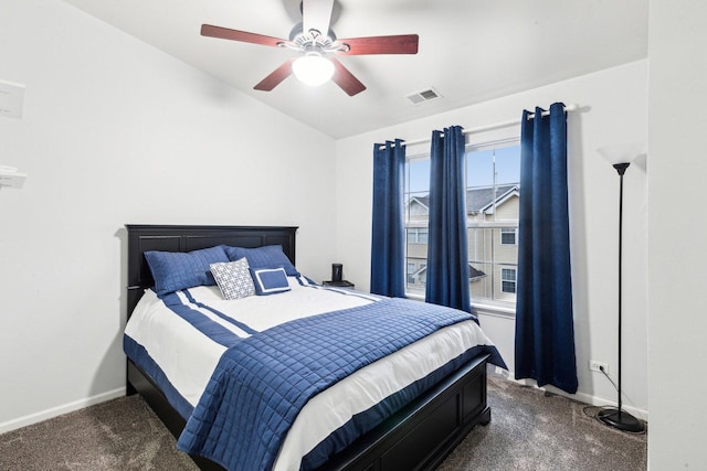 carpeted bedroom featuring lofted ceiling and ceiling fan