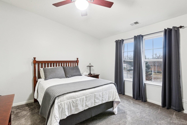 bedroom with vaulted ceiling, carpet floors, and ceiling fan