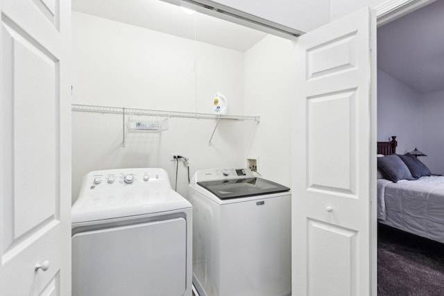 laundry area with separate washer and dryer and carpet flooring