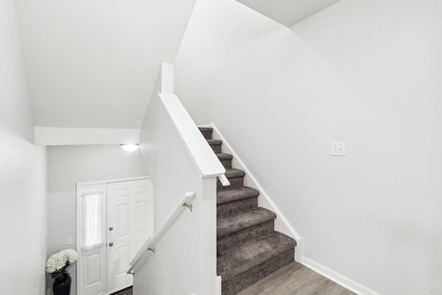 stairway featuring hardwood / wood-style floors