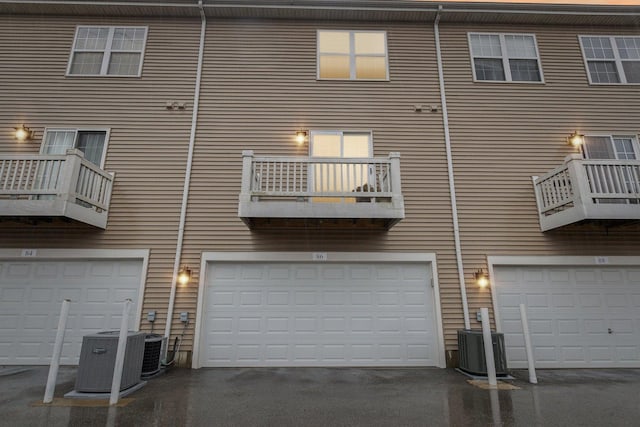 rear view of property featuring central AC unit