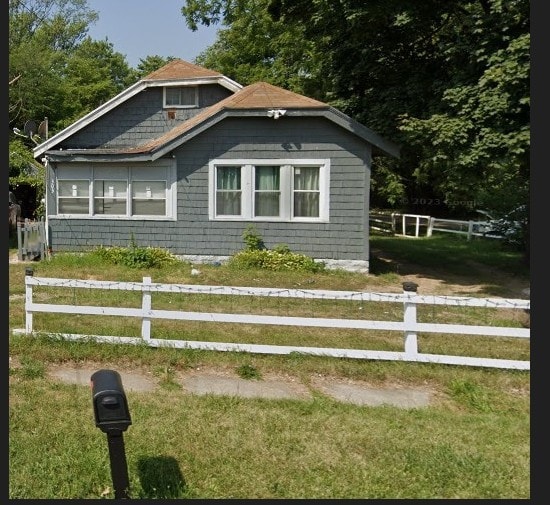 view of home's exterior featuring a yard