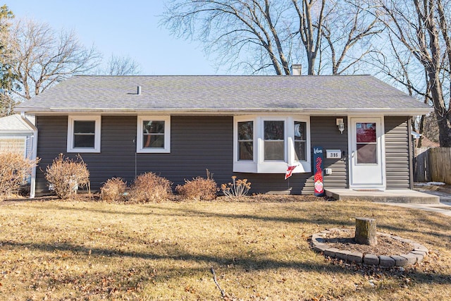 ranch-style house with a front lawn